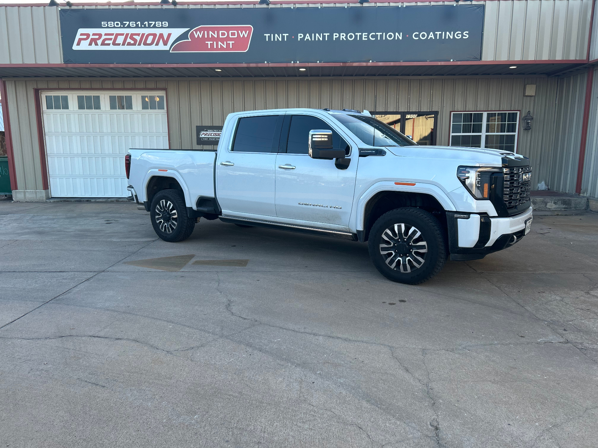 White GMC Denali HD truck with dark tint